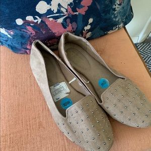 Tan loafers with stud embellishments